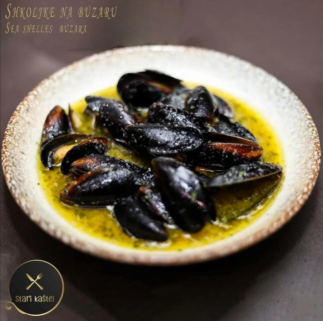 Mussels buzara (školjke na buzaru) — fresh Adriatic shellfish at Bistro Stari Kaštel, Novalja